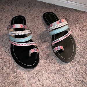 Restricted embellished sandals